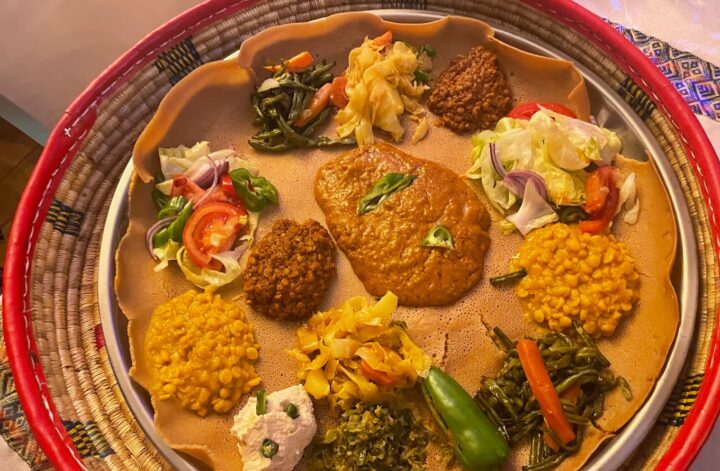 Discover the flavors of Ethiopia in London with our guide to the top Ethiopian restaurants in the city. From traditional stews to vegan options, we've got you covered for a delicious dining experience. #londonfoodguide #londonrestaurants | Places To Eat In London | Ethiopian Restaurants In London | African Restauarants In London | London Food Scene | Unique Places To Eat In London | Quirky Places To Eat In London #london #brixton #camberwell #camden #kentishtown #finsburypark #northlondon