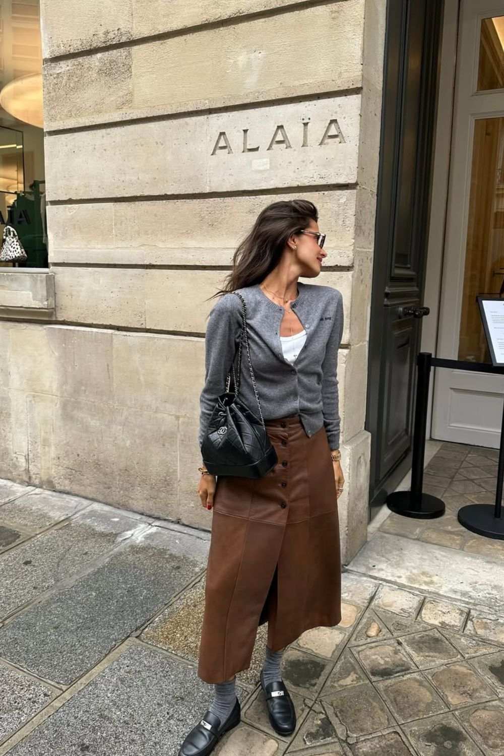 Long leather skirts are chic, versatile, and timeless. From casual street style with sneakers to bold color-block looks, discover 30+ stylish long leather skirt outfit ideas to inspire your wardrobe for work, weekends, and nights out. Perfect outfit inspiration for every season. Long Black Leather Skirt Outfit, Winter, Black, Midi Leather Skirt, Long Brown Leather Skirt Outfit, Long Faux Leather Skirt, How To Style A Long Leather Skirt, Outfits With Long Leather Skirt, Leather Midi Skirt Outfit