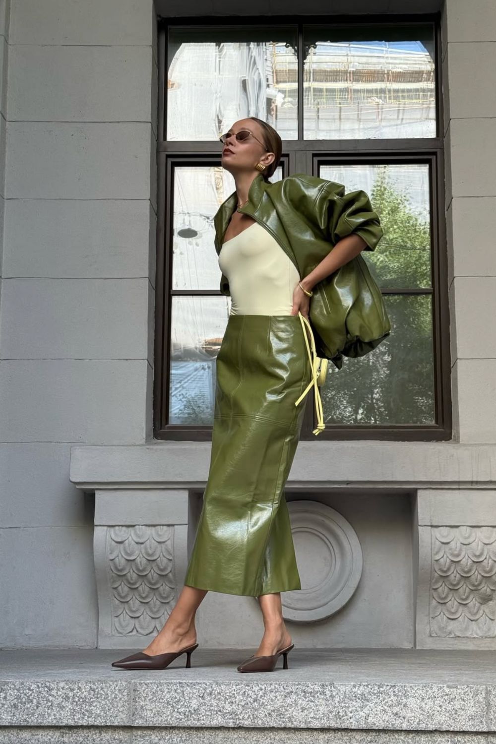 Long leather skirts are chic, versatile, and timeless. From casual street style with sneakers to bold color-block looks, discover 30+ stylish long leather skirt outfit ideas to inspire your wardrobe for work, weekends, and nights out. Perfect outfit inspiration for every season. Long Black Leather Skirt Outfit, Winter, Black, Midi Leather Skirt, Long Brown Leather Skirt Outfit, Long Faux Leather Skirt, How To Style A Long Leather Skirt, Outfits With Long Leather Skirt, Leather Midi Skirt Outfit