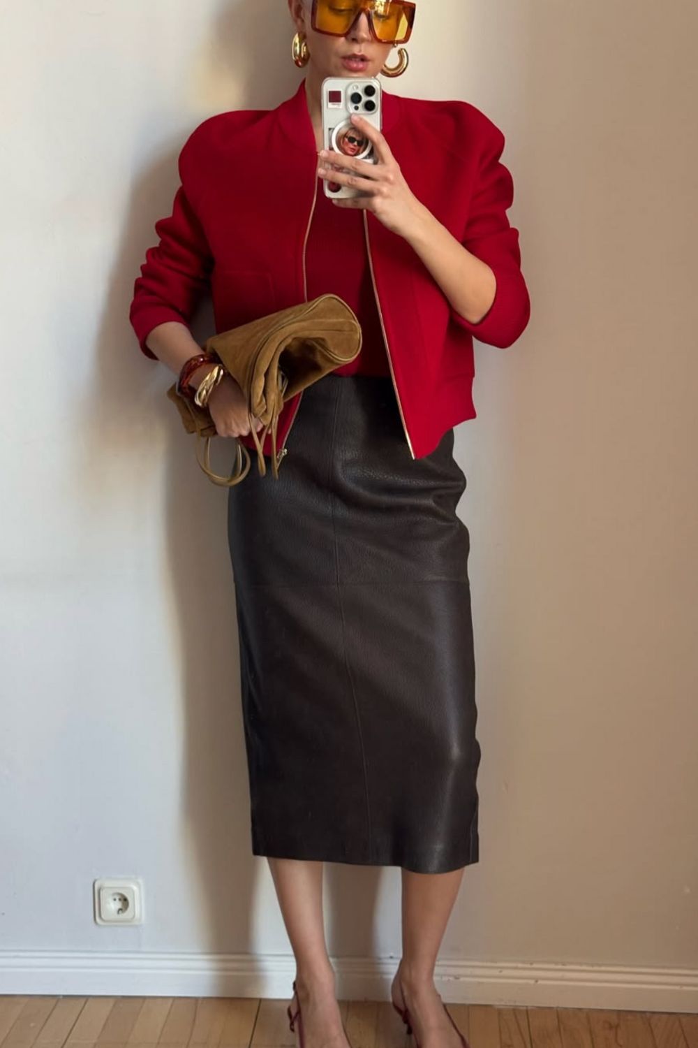 Long leather skirts are chic, versatile, and timeless. From casual street style with sneakers to bold color-block looks, discover 30+ stylish long leather skirt outfit ideas to inspire your wardrobe for work, weekends, and nights out. Perfect outfit inspiration for every season. Long Black Leather Skirt Outfit, Winter, Black, Midi Leather Skirt, Long Brown Leather Skirt Outfit, Long Faux Leather Skirt, How To Style A Long Leather Skirt, Outfits With Long Leather Skirt, Leather Midi Skirt Outfit