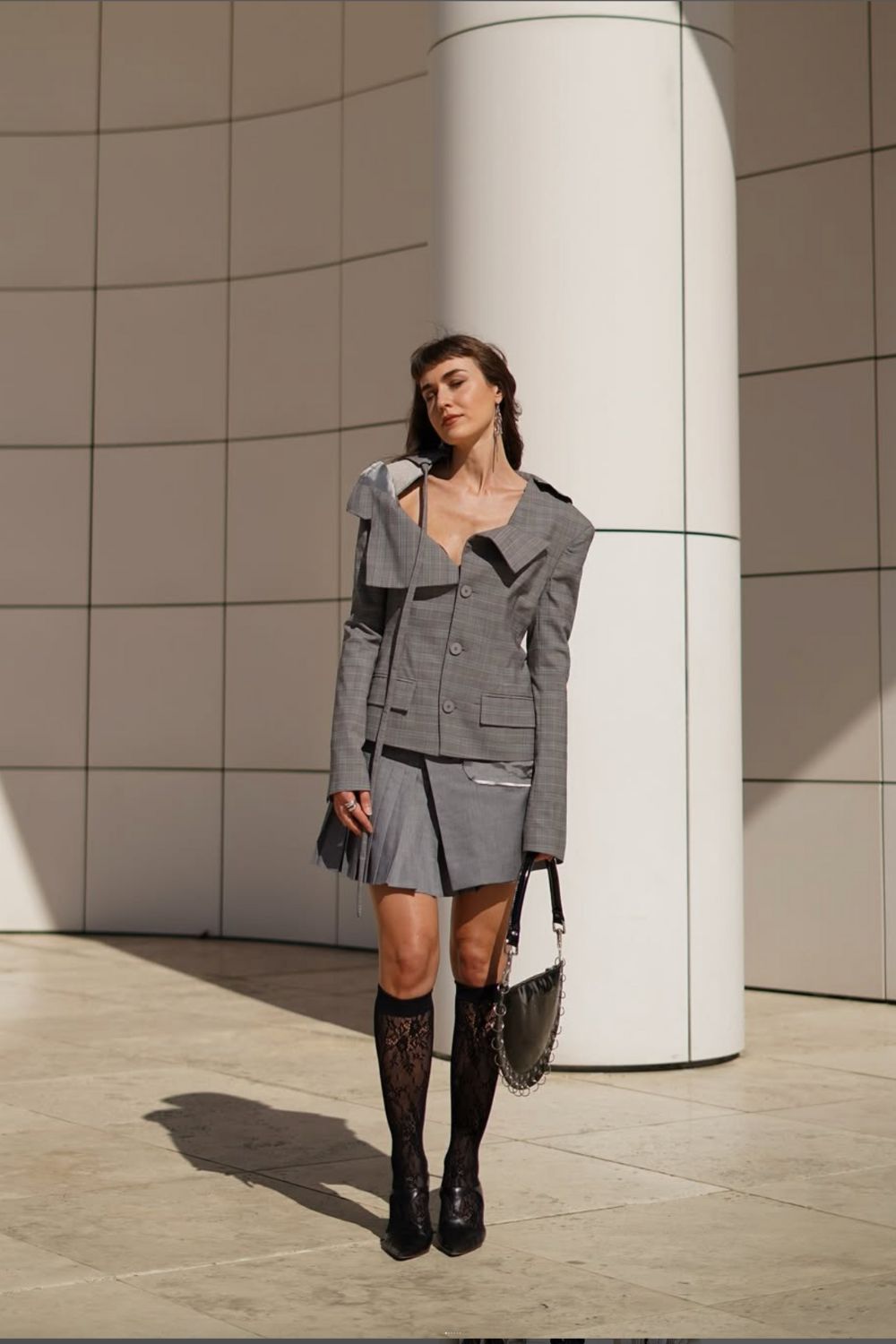 Discover 30+ chic grey mini skirt outfit ideas, from preppy layered looks to cozy knits and street-style classics. Get styling tips, seasonal inspiration, and trendy ways to wear a grey mini skirt all year round. Grey Mini Skirt Outfit Winter, Mini Grey Skirt Outfit, Grey Pleated Mini Skirt Outfit, Grey Mini Skirt Outfit Summer, Grey Mini Skirt Outfit Black Women, Grey Mini Skirt Outfit Aesthetic, Grey Pleated Skirt Outfit, Grey Satin Skirt Outfit, Grey Midi Skirt Outfit, Grey Midi Skirt Outfit