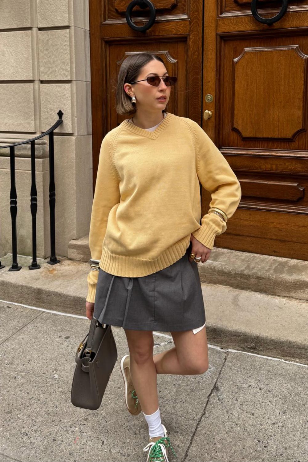 Discover 30+ chic grey mini skirt outfit ideas, from preppy layered looks to cozy knits and street-style classics. Get styling tips, seasonal inspiration, and trendy ways to wear a grey mini skirt all year round. Grey Mini Skirt Outfit Winter, Mini Grey Skirt Outfit, Grey Pleated Mini Skirt Outfit, Grey Mini Skirt Outfit Summer, Grey Mini Skirt Outfit Black Women, Grey Mini Skirt Outfit Aesthetic, Grey Pleated Skirt Outfit, Grey Satin Skirt Outfit, Grey Midi Skirt Outfit, Grey Midi Skirt Outfit