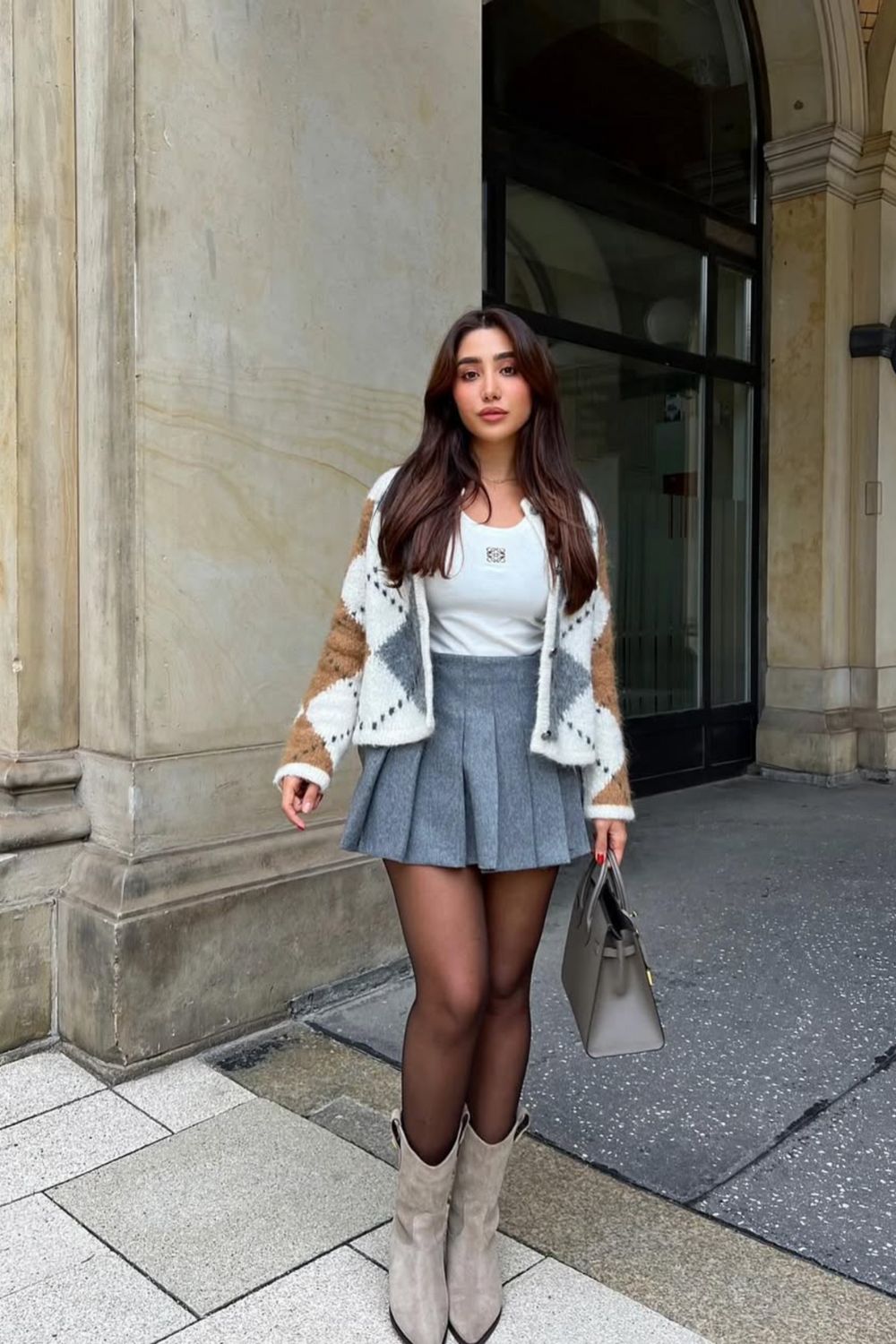 Discover 30+ chic grey mini skirt outfit ideas, from preppy layered looks to cozy knits and street-style classics. Get styling tips, seasonal inspiration, and trendy ways to wear a grey mini skirt all year round. Grey Mini Skirt Outfit Winter, Mini Grey Skirt Outfit, Grey Pleated Mini Skirt Outfit, Grey Mini Skirt Outfit Summer, Grey Mini Skirt Outfit Black Women, Grey Mini Skirt Outfit Aesthetic, Grey Pleated Skirt Outfit, Grey Satin Skirt Outfit, Grey Midi Skirt Outfit, Grey Midi Skirt Outfit