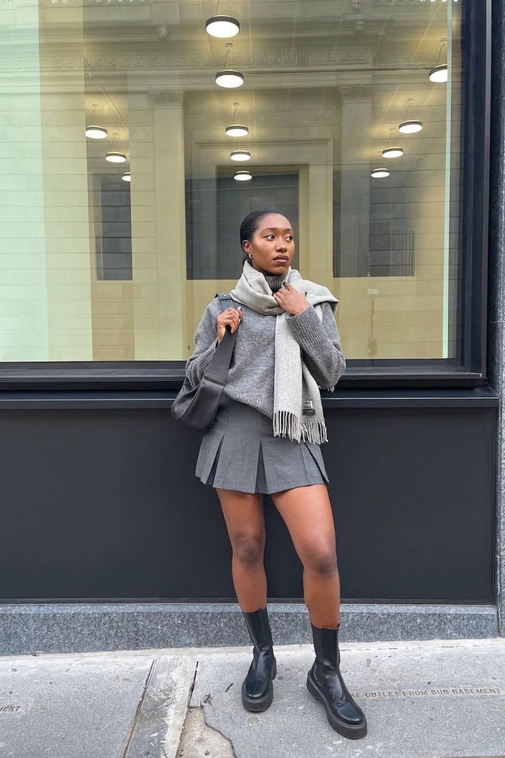 Discover 30+ chic grey mini skirt outfit ideas, from preppy layered looks to cozy knits and street-style classics. Get styling tips, seasonal inspiration, and trendy ways to wear a grey mini skirt all year round. Grey Mini Skirt Outfit Winter, Mini Grey Skirt Outfit, Grey Pleated Mini Skirt Outfit, Grey Mini Skirt Outfit Summer, Grey Mini Skirt Outfit Black Women, Grey Mini Skirt Outfit Aesthetic, Grey Pleated Skirt Outfit, Grey Satin Skirt Outfit, Grey Midi Skirt Outfit, Grey Midi Skirt Outfit