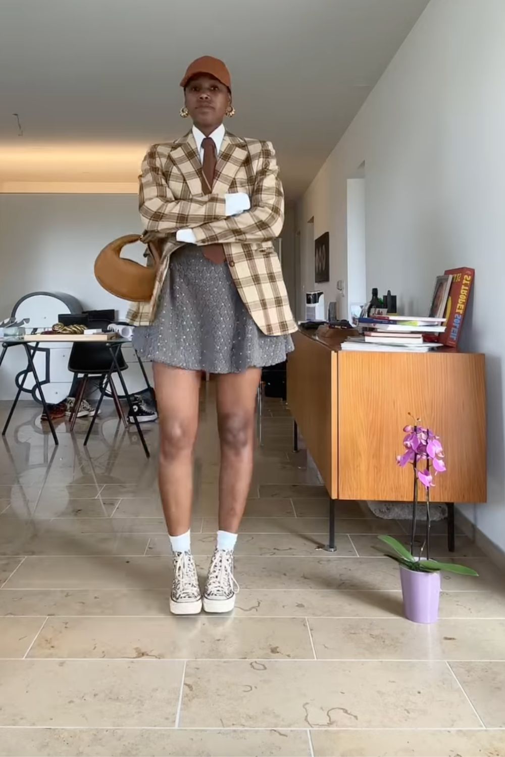 Discover 30+ chic grey mini skirt outfit ideas, from preppy layered looks to cozy knits and street-style classics. Get styling tips, seasonal inspiration, and trendy ways to wear a grey mini skirt all year round. Grey Mini Skirt Outfit Winter, Mini Grey Skirt Outfit, Grey Pleated Mini Skirt Outfit, Grey Mini Skirt Outfit Summer, Grey Mini Skirt Outfit Black Women, Grey Mini Skirt Outfit Aesthetic, Grey Pleated Skirt Outfit, Grey Satin Skirt Outfit, Grey Midi Skirt Outfit, Grey Midi Skirt Outfit