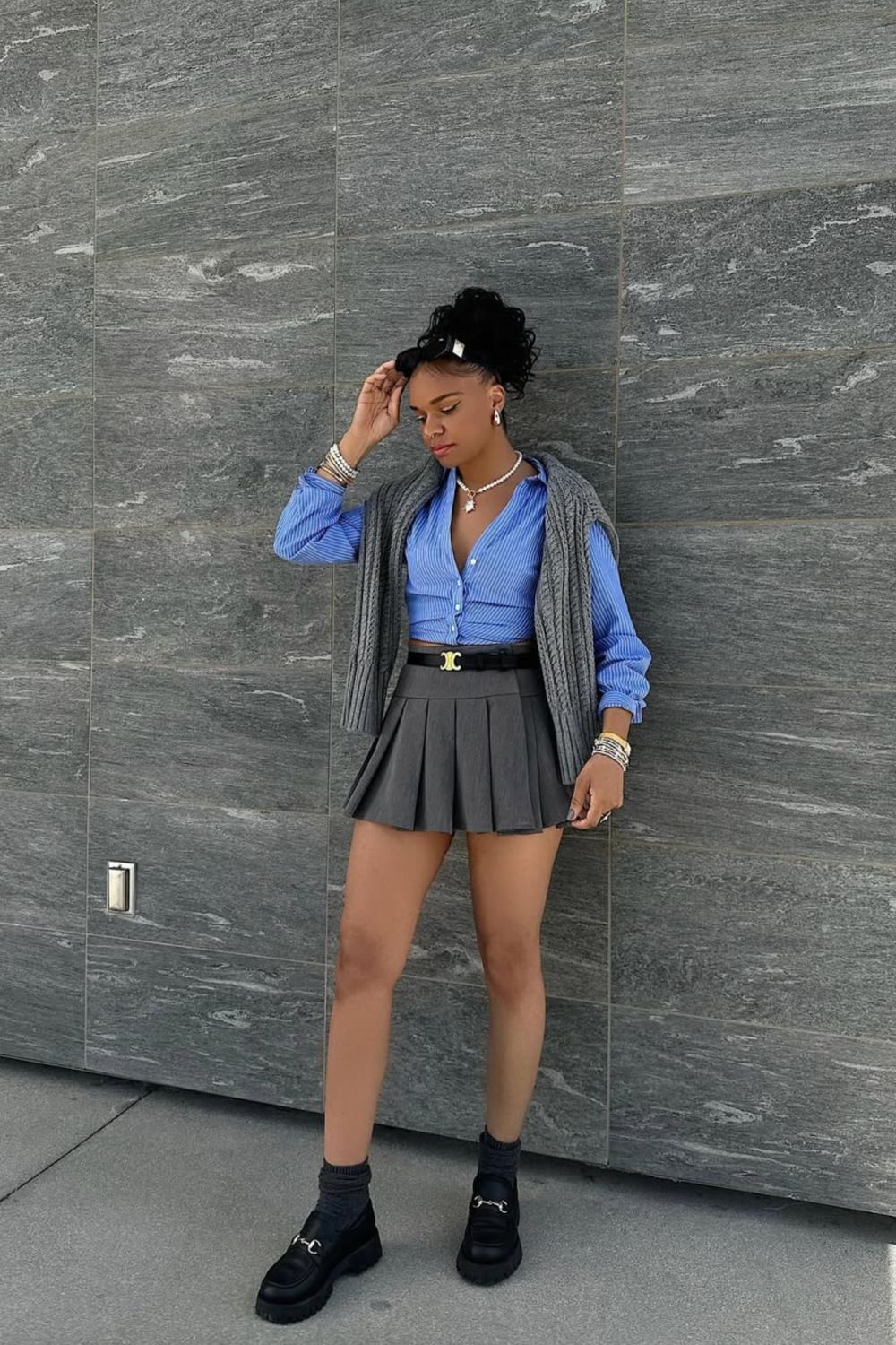 Discover 30+ chic grey mini skirt outfit ideas, from preppy layered looks to cozy knits and street-style classics. Get styling tips, seasonal inspiration, and trendy ways to wear a grey mini skirt all year round. Grey Mini Skirt Outfit Winter, Mini Grey Skirt Outfit, Grey Pleated Mini Skirt Outfit, Grey Mini Skirt Outfit Summer, Grey Mini Skirt Outfit Black Women, Grey Mini Skirt Outfit Aesthetic, Grey Pleated Skirt Outfit, Grey Satin Skirt Outfit, Grey Midi Skirt Outfit, Grey Midi Skirt Outfit