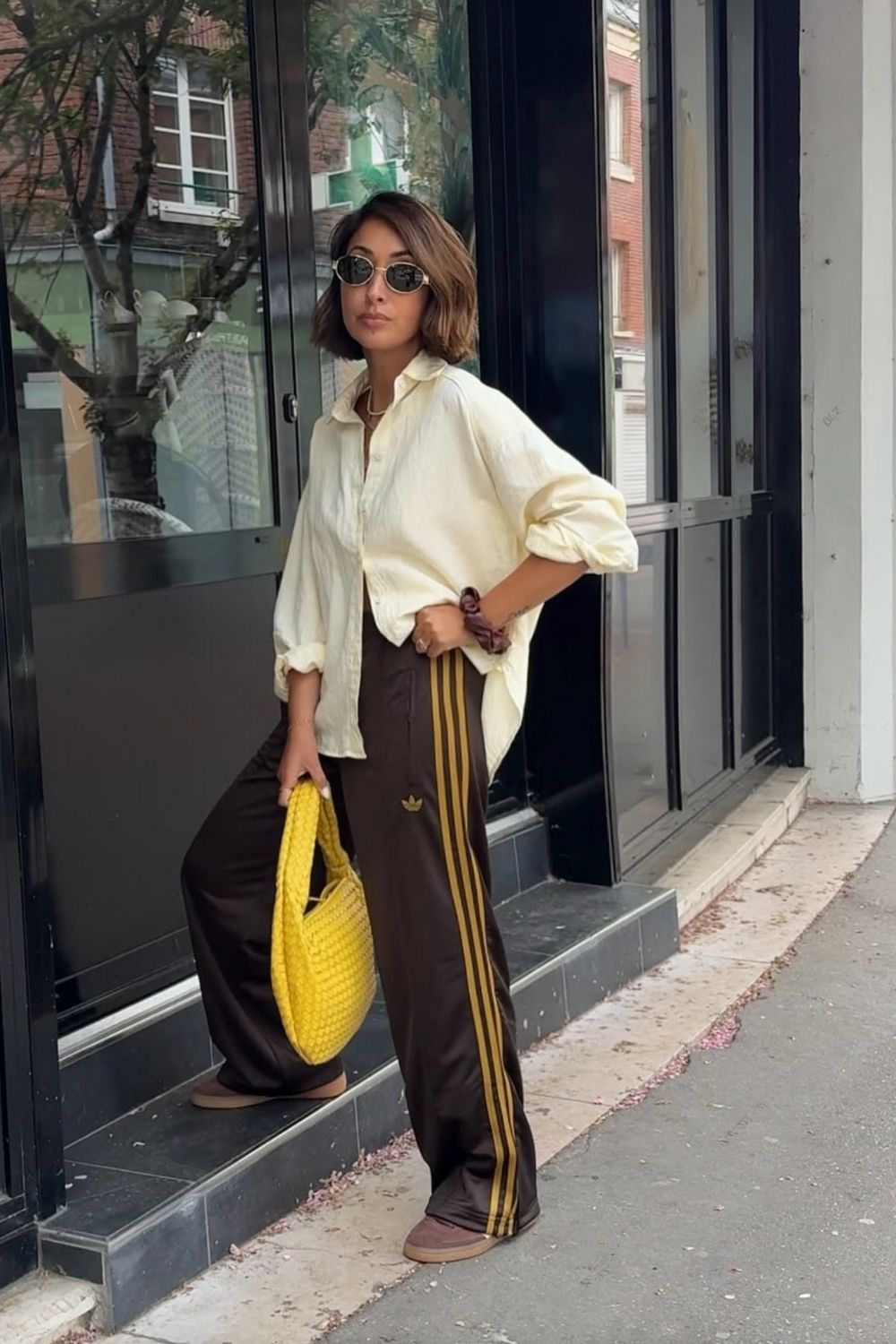 Discover chic Adidas track pants outfit ideas that blend sporty comfort with street-style flair. From cozy layers to elevated casual looks, learn how to style your favorite three-stripe pants for every season and occasion. Adidas Track Pants Outfit Woman, Adidas Track Pants Outfit Aesthetic, Adidas Track Jacket Outfit Street Style, Adidas Track Shorts Outfit, Black Adidas Track Pants Outfit, Blue Adidas Track Pants Outfit, Adidas Track Suit Outfit, Adidas Track Pants Outfit Winter, Adidas Track Pants Outfit Casual, Adidas Track Top Outfit