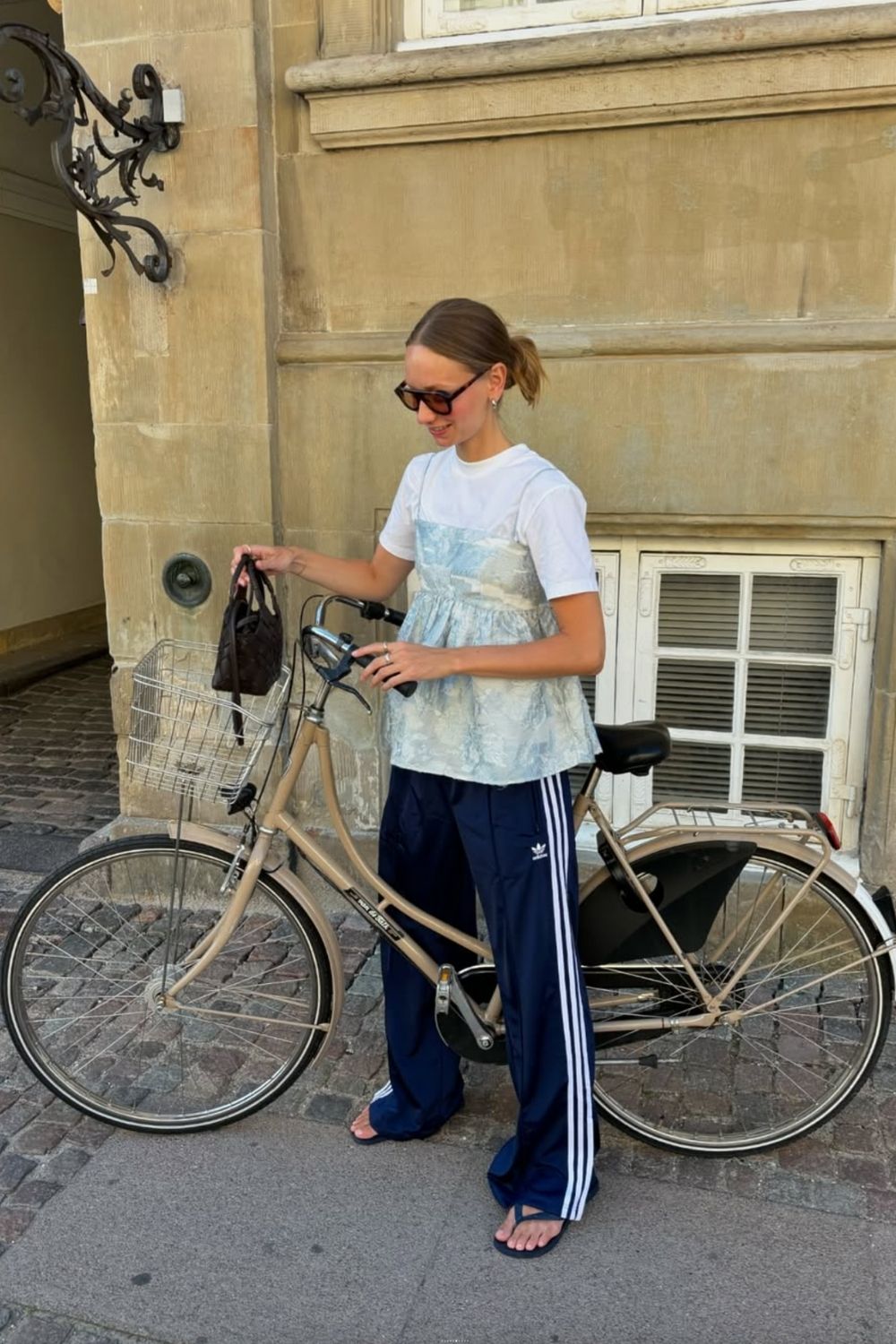 Discover chic Adidas track pants outfit ideas that blend sporty comfort with street-style flair. From cozy layers to elevated casual looks, learn how to style your favorite three-stripe pants for every season and occasion. Adidas Track Pants Outfit Woman, Adidas Track Pants Outfit Aesthetic, Adidas Track Jacket Outfit Street Style, Adidas Track Shorts Outfit, Black Adidas Track Pants Outfit, Blue Adidas Track Pants Outfit, Adidas Track Suit Outfit, Adidas Track Pants Outfit Winter, Adidas Track Pants Outfit Casual, Adidas Track Top Outfit