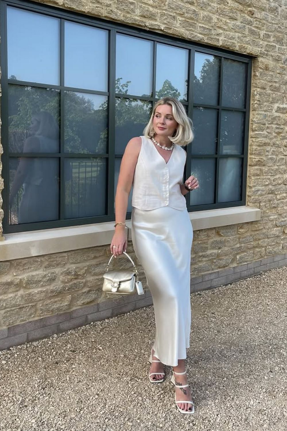 Discover chic white satin skirt outfit ideas for every season, from casual everyday looks to elegant evening styles. Learn how to style a white satin skirt with knits, blazers, sneakers, and heels for effortless, polished outfits. Satin White Skirt Outfit, White Satin Skirt Outfit Winter, White Satin Skirt Outfit Summer, Off White Satin Skirt Outfit, White Satin Maxi Skirt Outfit, White Satin Midi Skirt Outfit, Long White Satin Skirt Outfit, Short White Satin Skirt Outfit, Long Satin Skirt Outfit, Satin Skirt Outfit Classy, Satin Skirt Outfit Winter, Satin Skirt Outfit Summer, Satin Maxi Skirt Outfit, Satin Skirt Outfit Casual, Satin Skirt Outfit Hijab, Satin Skirt Outfit Elegant, Satin Skirt Winter Outfit, Maxi Satin Skirt Outfit, Midi Satin Skirt Outfit, Satin Long Skirt Outfit