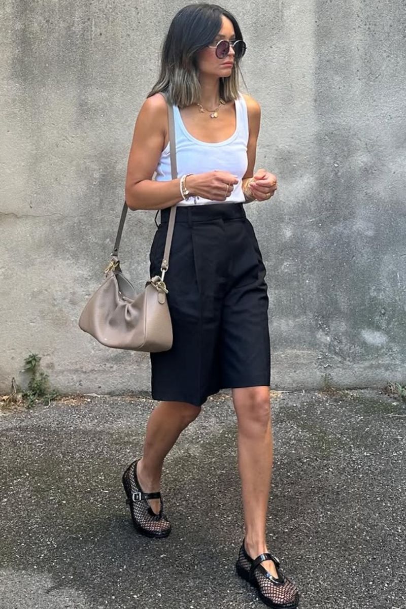 Discover chic and effortless ways to style black Bermuda shorts with these elevated outfit ideas. From tailored blazers and sleek tanks to casual sweatshirts and statement accessories, this guide covers versatile looks perfect for any occasion—whether you're dressing up or keeping it relaxed. Black Bermuda Shorts Outfit Classy, Black Bermuda Shorts Outfit Summer Women, Black Bermuda Shorts Outfit Summer, Black Bermuda Shorts Outfit Spring, Black Bermuda Shorts Outfit Spring, Black Bermuda Shorts Outfit Winter, Black Bermuda Shorts Outfit Casual, Black Bermuda Shorts Outfit Women, Black Bermuda Shorts Outfit Aesthetic, Black Bermuda Shorts Outfit Sneakers, Black Bermuda Shorts With Sneakers, Black Bermuda Shorts With Loafers, What To Wear With Black Bermuda Shorts, Black Top