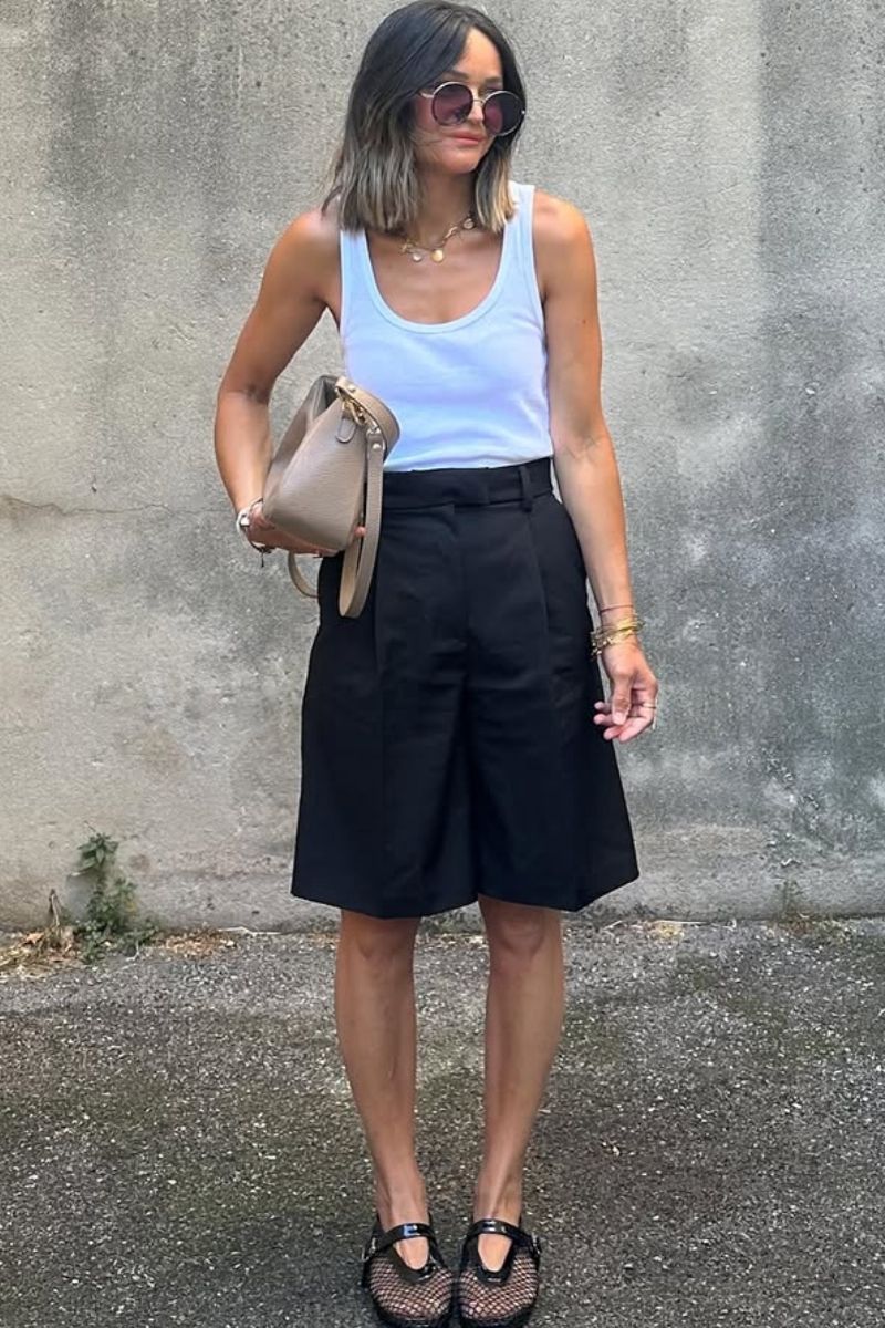 Discover chic and effortless ways to style black Bermuda shorts with these elevated outfit ideas. From tailored blazers and sleek tanks to casual sweatshirts and statement accessories, this guide covers versatile looks perfect for any occasion—whether you're dressing up or keeping it relaxed. Black Bermuda Shorts Outfit Classy, Black Bermuda Shorts Outfit Summer Women, Black Bermuda Shorts Outfit Summer, Black Bermuda Shorts Outfit Spring, Black Bermuda Shorts Outfit Spring, Black Bermuda Shorts Outfit Winter, Black Bermuda Shorts Outfit Casual, Black Bermuda Shorts Outfit Women, Black Bermuda Shorts Outfit Aesthetic, Black Bermuda Shorts Outfit Sneakers, Black Bermuda Shorts With Sneakers, Black Bermuda Shorts With Loafers, What To Wear With Black Bermuda Shorts, Black Top