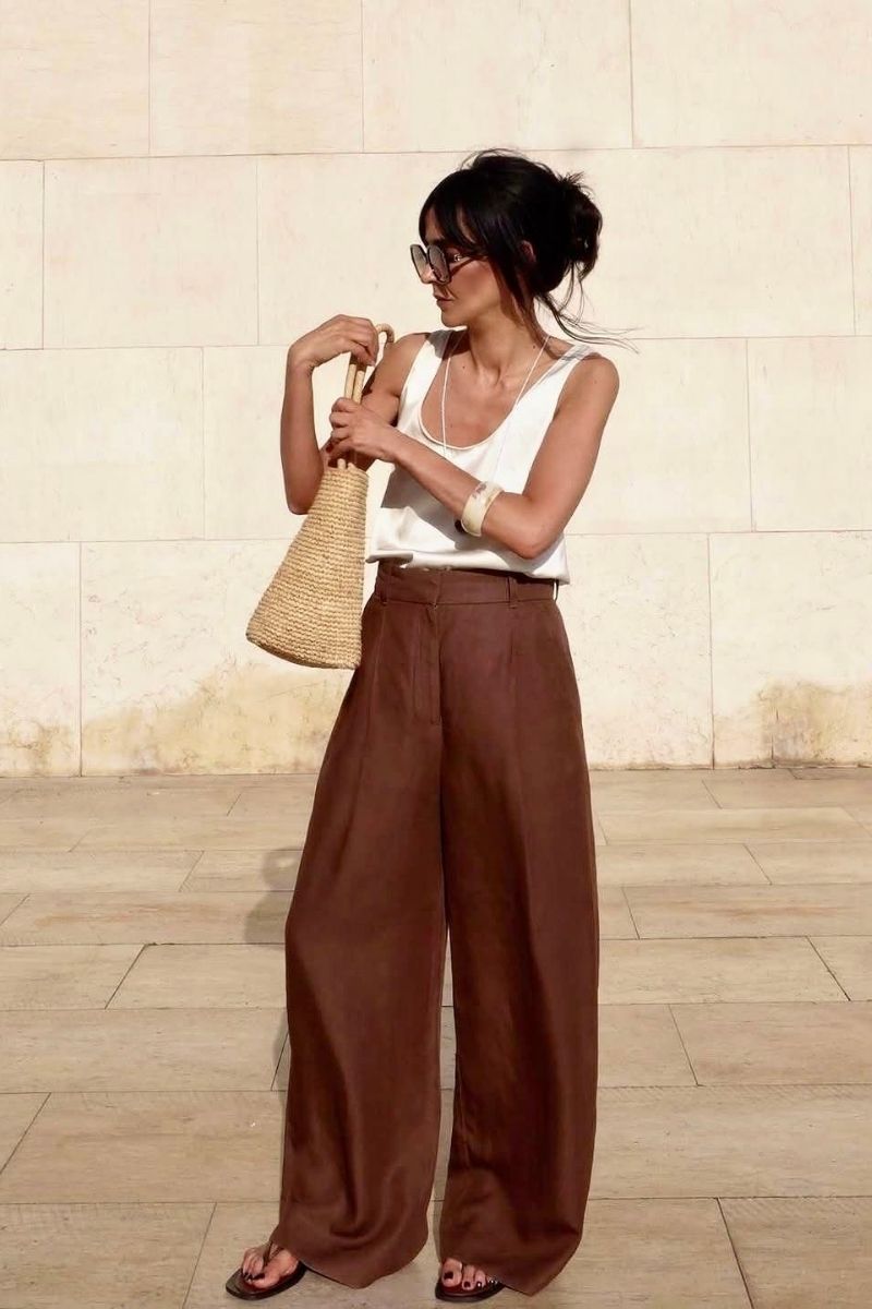 Discover effortlessly chic brown linen pants outfit ideas you’ll want to wear on repeat. From casual everyday looks to elevated, polished styles, this guide covers exactly how to style brown linen pants with modern pieces, accessories, and layering tips for every season. Brown Linen Pants Outfit, Brown Linen Pants Outfit Summer, Brown Linen Pants Outfit Work, Brown Linen Pants Outfit For Women, Brown Linen Pants Outfit Winter, Brown Linen Pants Outfit Spring, Brown Linen Pants Outfit Summer Casual, Brown Linen Pants Outfit Aesthetic, Office Outfit, Brown Linen Pants With Black Top, Brown Linen Pants With White Top, Brown Linen Pants With Sweater, Brown Linen Pants With Sneakers, Brown Linen Pants With Black Shirt, Brown Linen Pants With Pink Top, Brown Linen Pants With Blue Shirt