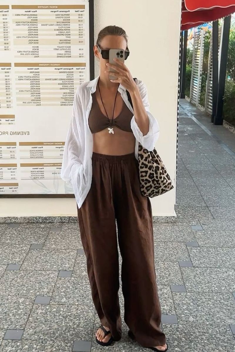 Discover effortlessly chic brown linen pants outfit ideas you’ll want to wear on repeat. From casual everyday looks to elevated, polished styles, this guide covers exactly how to style brown linen pants with modern pieces, accessories, and layering tips for every season. Brown Linen Pants Outfit, Brown Linen Pants Outfit Summer, Brown Linen Pants Outfit Work, Brown Linen Pants Outfit For Women, Brown Linen Pants Outfit Winter, Brown Linen Pants Outfit Spring, Brown Linen Pants Outfit Summer Casual, Brown Linen Pants Outfit Aesthetic, Office Outfit, Brown Linen Pants With Black Top, Brown Linen Pants With White Top, Brown Linen Pants With Sweater, Brown Linen Pants With Sneakers, Brown Linen Pants With Black Shirt, Brown Linen Pants With Pink Top, Brown Linen Pants With Blue Shirt