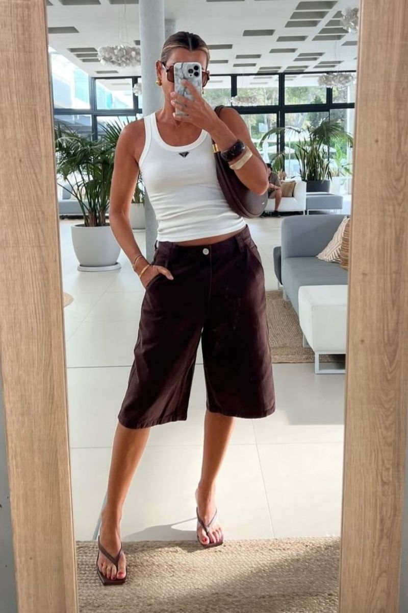 Looking for stylish ways to wear brown shorts? Discover chic brown shorts outfit ideas you can easily recreate, from tailored bermuda looks to casual everyday styling. Whether you’re dressing for brunch, travel, or summer days out, these outfit ideas will help you look effortlessly polished and put together.&nbsp;Brown Shorts With Boots, Brown Shorts With Black Top, Brown Shorts With Belt, Brown Shorts With White Top, Brown Shorts With Black Boots, Brown Shorts With Top, What To Wear With Chocolate Brown Shorts, What Color Shirt To Wear With Brown Shorts, What Shirt Goes With Brown Shorts, What Goes With Brown Shorts, What To Pair Brown Shorts With, Brown Shorts Outfit Summer, Brown Shorts Outfits Women Summer, Brown Shorts Outfit Casual, Club Outfit, Brown Shorts Outfit Ideas