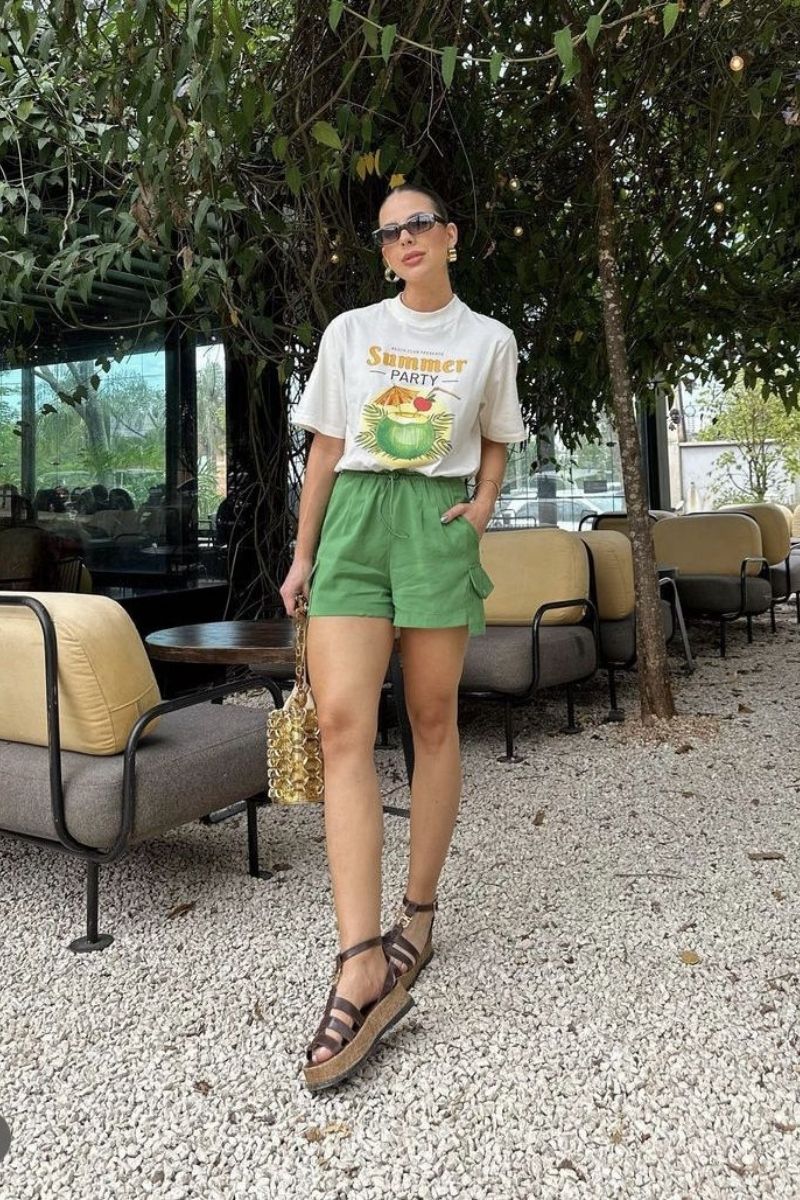 Discover chic and effortless green shorts outfit ideas you’ll want to wear all season long. From tailored looks to casual street style, this guide shows you exactly how to style green shorts with confidence using color pairing tips, accessories, and elevated outfit inspiration for any occasion. What To Where With Green Shorts, What To Wear Green Shorts, What To Wear With Green And White Shorts, What To Wear With Green Shorts Outfits, What Goes With Green Shorts, What To Wear With Light Green Shorts, What Goes With Olive Green Shorts, Green Shorts With Pink Stripes Outfit, Green Shorts With White Top, Green Shorts With Boots, Green Shorts With Pink Top, Green Shorts Outfits Women, Green Shorts Outfit Ideas, Green Shorts Outfit Aesthetic, Green Shorts Fit