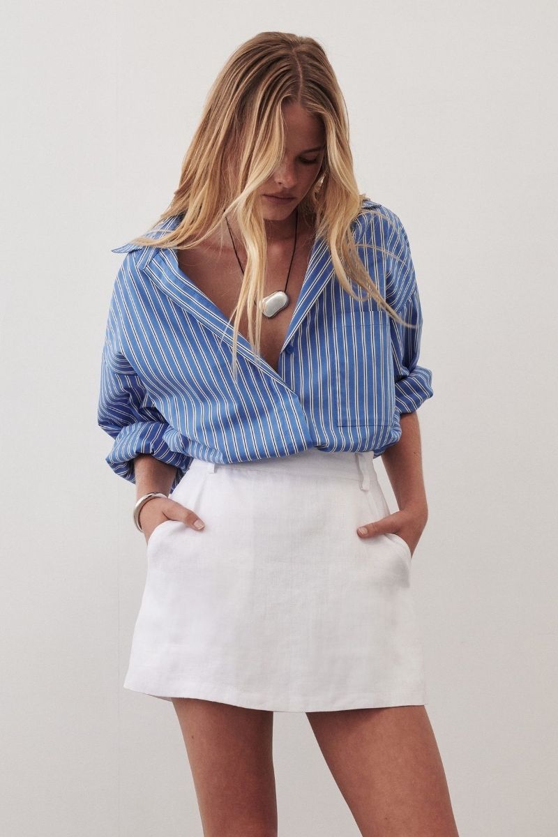 Discover the best linen mini skirt outfit ideas for summer, from chic neutral co-ords to casual oversized shirt looks and elevated vacation outfits. I’m sharing stylish ways to wear linen mini skirts with sandals, sneakers, tanks, vests, and effortless accessories for an easy yet polished warm-weather wardrobe. Linen Mini Skirt Outfit, Linen Mini Skirt Outfit Summer, Linen Mini Skirt Outfit Ideas, Linen Mini Skirt Set, Linen Mini Skirt Outfit Black, Linen Mini Skirt Outfit Black, Linen Mini Skirt And Top Set, Black, White, Sweater, Linen Mini Skirt With Boots, With Belt, What To Wear With A White Linen Mini Skirt, Short Linen Skirt Outfit Summer, Short Linen Skirt Styling, Short Linen Skirt Outfit Fall, Short Linen Skirt Outfit Casual, Plus Size, Short Linen Skirt Fits