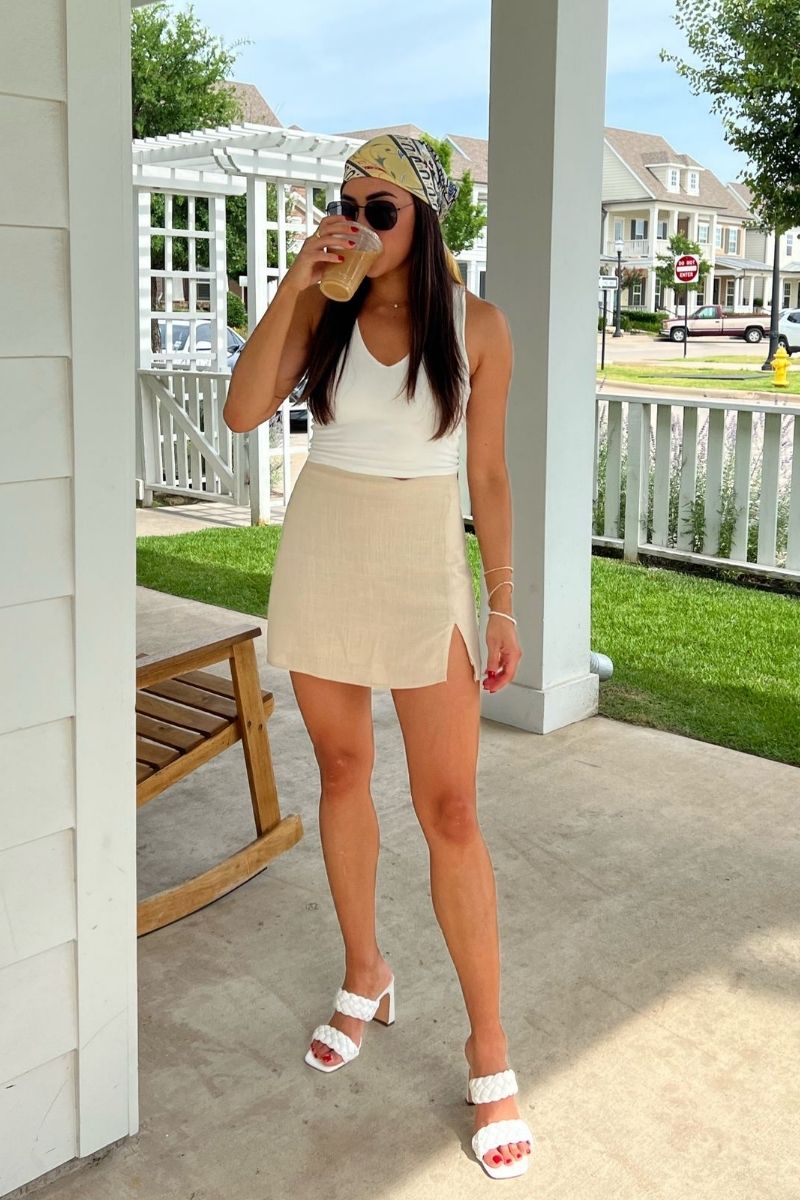 Discover the best linen mini skirt outfit ideas for summer, from chic neutral co-ords to casual oversized shirt looks and elevated vacation outfits. I’m sharing stylish ways to wear linen mini skirts with sandals, sneakers, tanks, vests, and effortless accessories for an easy yet polished warm-weather wardrobe. Linen Mini Skirt Outfit, Linen Mini Skirt Outfit Summer, Linen Mini Skirt Outfit Ideas, Linen Mini Skirt Set, Linen Mini Skirt Outfit Black, Linen Mini Skirt Outfit Black, Linen Mini Skirt And Top Set, Black, White, Sweater, Linen Mini Skirt With Boots, With Belt, What To Wear With A White Linen Mini Skirt, Short Linen Skirt Outfit Summer, Short Linen Skirt Styling, Short Linen Skirt Outfit Fall, Short Linen Skirt Outfit Casual, Plus Size, Short Linen Skirt Fits