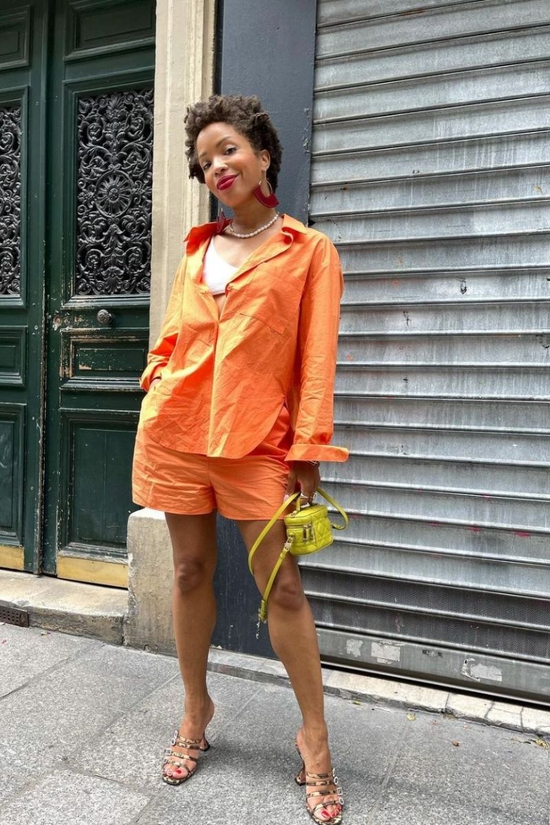 Discover chic and stylish orange shorts outfit ideas perfect for summer, from casual everyday looks to elevated, polished ensembles. Explore how to style orange shorts with statement pieces, bold color combinations, and effortless layering for outfits that feel modern, confident, and fashion-forward. Orange Shorts Outfit Summer, Orange Shorts Outfits, Orange Shorts Outfit Summer Casual, Orange Shorts Outfit Ideas, Orange Shorts Outfit Aesthetic, Orange Shorts Outfit Winter, Orange Sweater Outfit With Shorts, Outfit Ideas With Orange Shorts, Beach Outfit With Orange Shorts, What To Wear With Orange Shorts Outfit