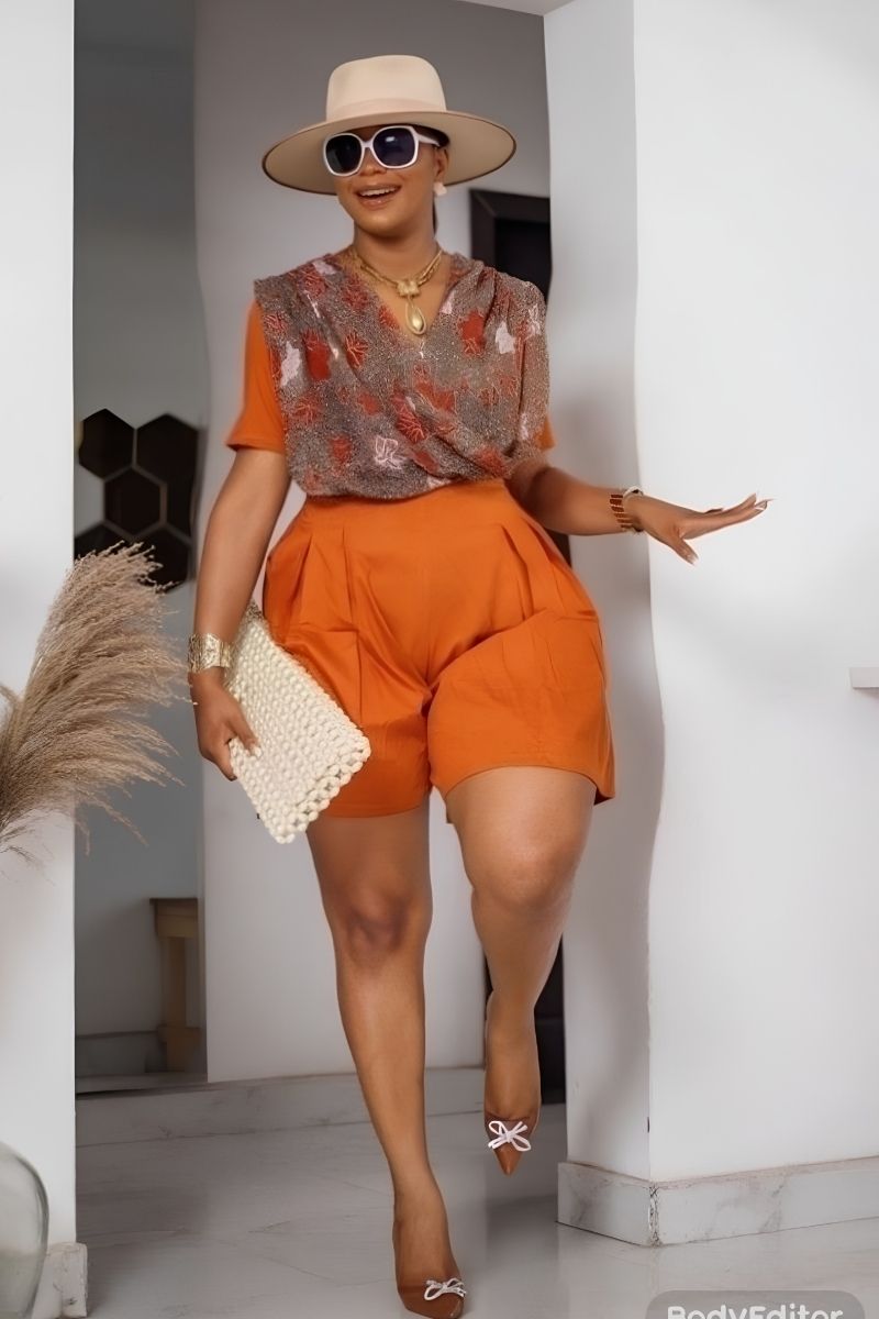 Discover chic and stylish orange shorts outfit ideas perfect for summer, from casual everyday looks to elevated, polished ensembles. Explore how to style orange shorts with statement pieces, bold color combinations, and effortless layering for outfits that feel modern, confident, and fashion-forward. Orange Shorts Outfit Summer, Orange Shorts Outfits, Orange Shorts Outfit Summer Casual, Orange Shorts Outfit Ideas, Orange Shorts Outfit Aesthetic, Orange Shorts Outfit Winter, Orange Sweater Outfit With Shorts, Outfit Ideas With Orange Shorts, Beach Outfit With Orange Shorts, What To Wear With Orange Shorts Outfit