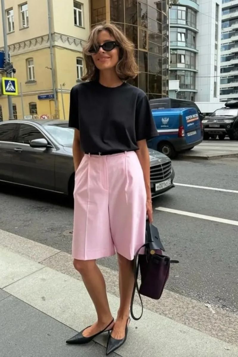 Discover chic and effortless pink shorts outfit ideas you’ll want to wear all summer long. From tailored Bermuda styles to bold hot pink looks, this guide covers how to style pink shorts with elevated basics, statement pieces, and on-trend accessories for every occasion. Pink Shorts Outfit Women, Pink Shorts Outfits Summer, Pink Shorts Outfit Ideas, Pink Shorts Outfits Summer Casual, Pink Shorts Outfits Casual, Pink Shorts Outfits Summer Street Styles, Pink Shorts Outfits Beach, Cute Outfit Ideas With Pink Shorts, Outfit Ideas With Light Pink Shorts, What To Wear With Pink And White Striped Shorts, What Tops To Wear With Pink Shorts, What Goes With Pink Shorts