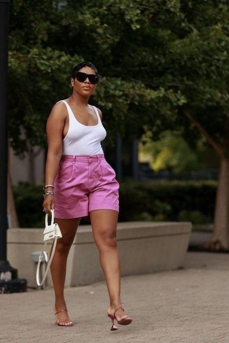 Discover chic and effortless pink shorts outfit ideas you’ll want to wear all summer long. From tailored Bermuda styles to bold hot pink looks, this guide covers how to style pink shorts with elevated basics, statement pieces, and on-trend accessories for every occasion. Pink Shorts Outfit Women, Pink Shorts Outfits Summer, Pink Shorts Outfit Ideas, Pink Shorts Outfits Summer Casual, Pink Shorts Outfits Casual, Pink Shorts Outfits Summer Street Styles, Pink Shorts Outfits Beach, Cute Outfit Ideas With Pink Shorts, Outfit Ideas With Light Pink Shorts, What To Wear With Pink And White Striped Shorts, What Tops To Wear With Pink Shorts, What Goes With Pink Shorts