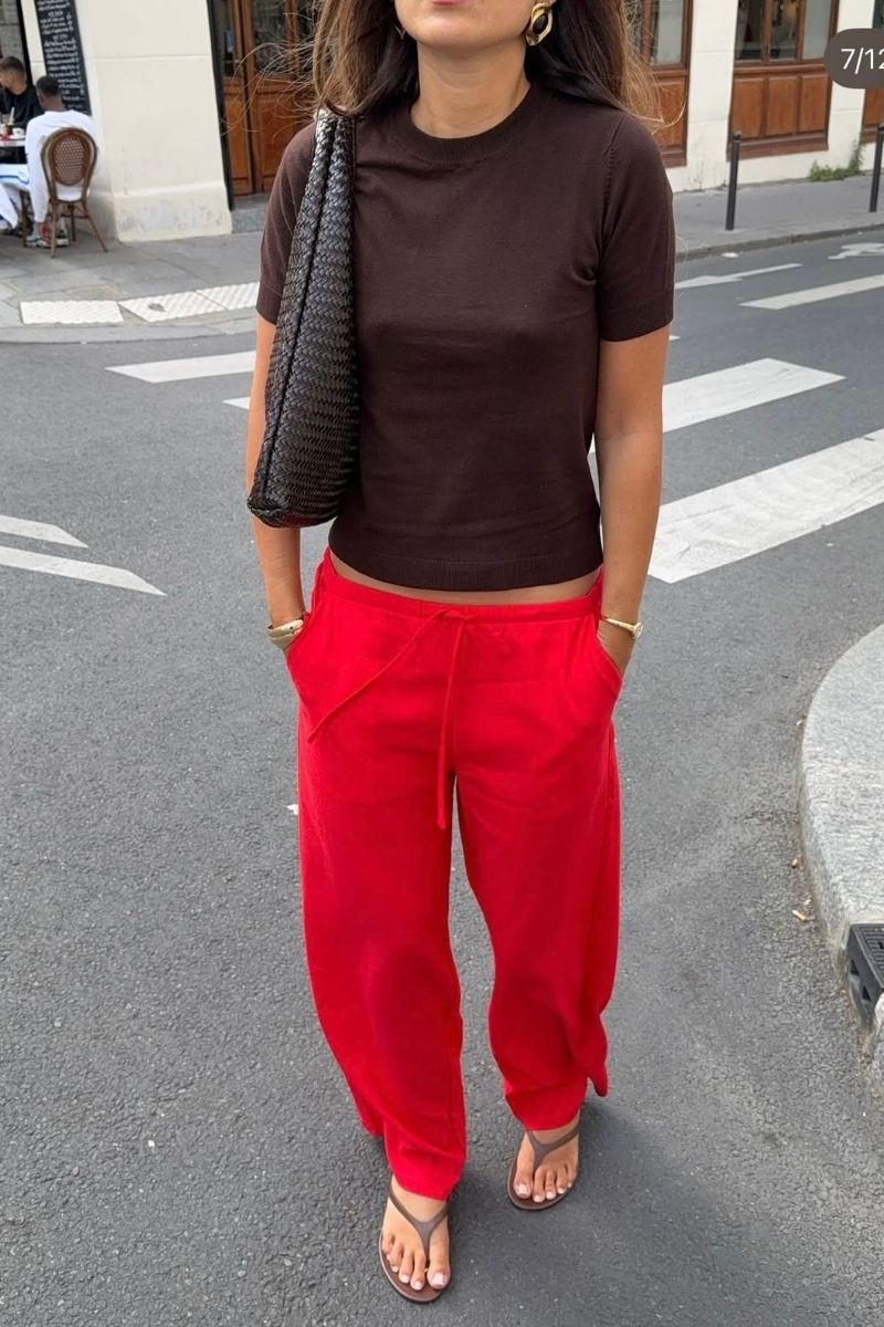 Discover how to style red linen pants with these effortlessly chic outfit ideas. From casual everyday looks to elevated summer styling, explore flattering combinations, must-have accessories, and fashion-forward ways to wear this bold wardrobe staple with confidence. Red Linen Pants With Black Top, Red Top With Linen Pants, White Linen Pants With Red Top, Linen Pants With Red Shoes, Outfits With Red Linen Pants, Red Tank Top With Linen Pants, Red Linen Pants Outfit Summer, Red Linen Pants Outfit Work, Red Linen Pants Outfit Casual, Red Linen Pants Outfit Winter, Red Linen Pants Outfit Men, Red Linen Pants Outfit Fall, Red Linen Pants Set, Red Linen Pants Beach Outfit, Red Linen Pants Outfit Ideas, Red Linen Pants Styling