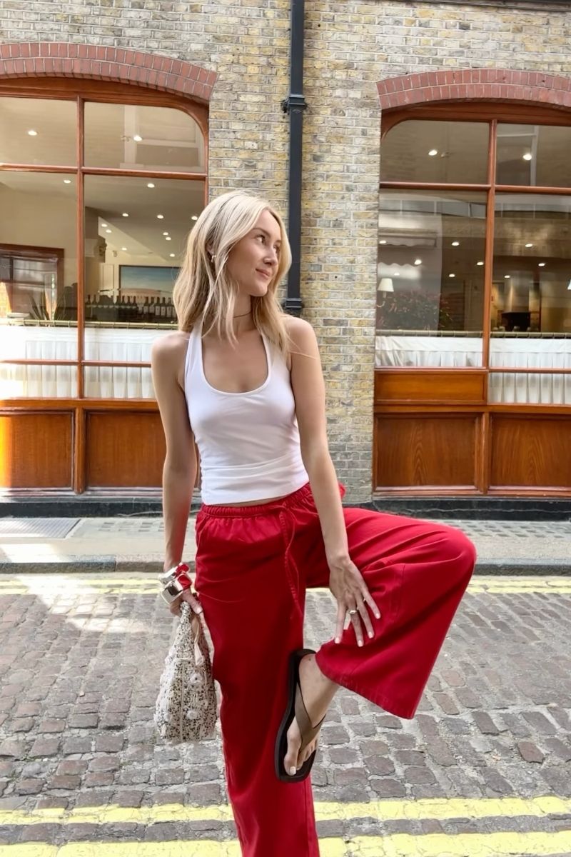 Discover how to style red linen pants with these effortlessly chic outfit ideas. From casual everyday looks to elevated summer styling, explore flattering combinations, must-have accessories, and fashion-forward ways to wear this bold wardrobe staple with confidence. Red Linen Pants With Black Top, Red Top With Linen Pants, White Linen Pants With Red Top, Linen Pants With Red Shoes, Outfits With Red Linen Pants, Red Tank Top With Linen Pants, Red Linen Pants Outfit Summer, Red Linen Pants Outfit Work, Red Linen Pants Outfit Casual, Red Linen Pants Outfit Winter, Red Linen Pants Outfit Men, Red Linen Pants Outfit Fall, Red Linen Pants Set, Red Linen Pants Beach Outfit, Red Linen Pants Outfit Ideas, Red Linen Pants Styling