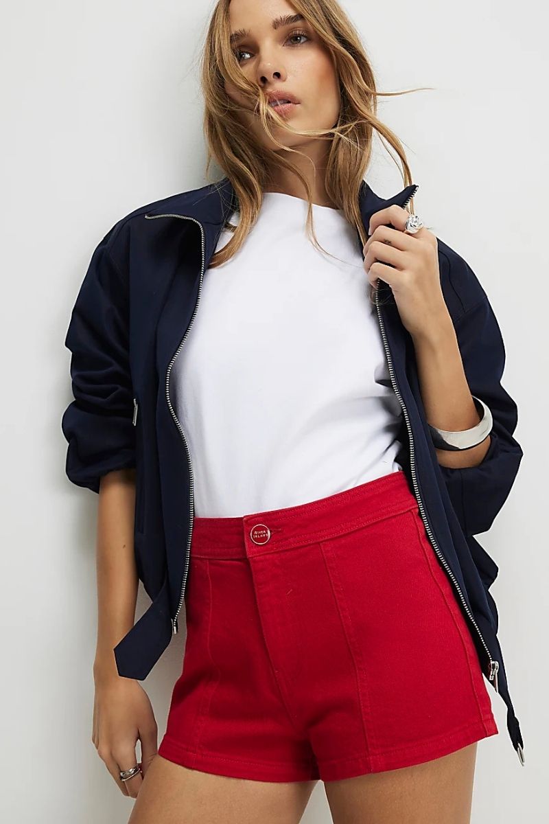 Discover chic and effortless ways to style red shorts with these fashion-forward outfit ideas. From casual everyday looks to polished, elevated ensembles, explore how to pair red shorts with blouses, shirts, and accessories for every occasion while creating stylish, confidence-boosting outfits. What To Wear W Red Shorts, What Looks Good With Red Shorts, What Matches With Red Shorts, What Color Shirt To Wear With Red Shorts, What To Wear With Red Gingham Shorts, What To Wear With Red Sport Shorts, Red Shorts With Boots, Red Shorts With Cowboy Boots, Red Shorts With Black Shirt, Red Shorts With Heels, Red Shorts Outfits Women, Red Shorts Outfit Ideas, Red Shorts Outfit Aesthetic, Red Shorts Outfit Summer Casual, Red Shorts Styling