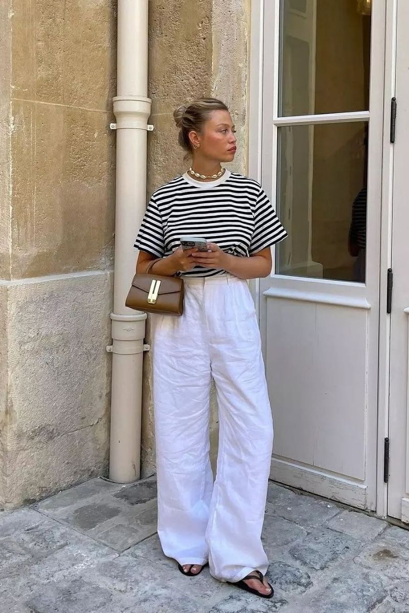 Discover chic and effortless white linen pants outfit ideas you can wear all season long. From casual everyday looks to elevated summer styling, explore how to pair linen trousers with timeless staples, bold colors, and must-have accessories for a polished, fashion-forward wardrobe. White Linen Pants With Sneakers, White Linen Pants With Sweater, White Linen Pants With Black Top, White Linen Pants With Chelsea Boots, White Linen Pants With Blue Shirt, White Linen Pants With White Top, White Linen Pants With Black Shirt, White Linen Pants With Shirt, White Linen Pants With Red Top, White Linen Pants With Blue Top, White Linen Pants Outfit, White Linen Pants Outfit Summer, White Linen Pants Outfit Casual, White Linen Pants Outfit Dressy Classy, White Linen Pants Outfit Work, Beach, Dressy